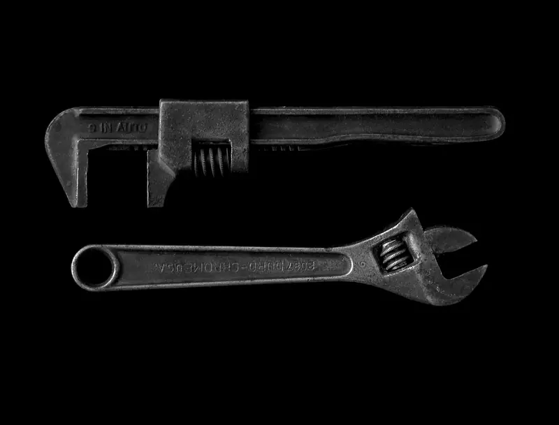 A pipe wrench and an adjustable spanner