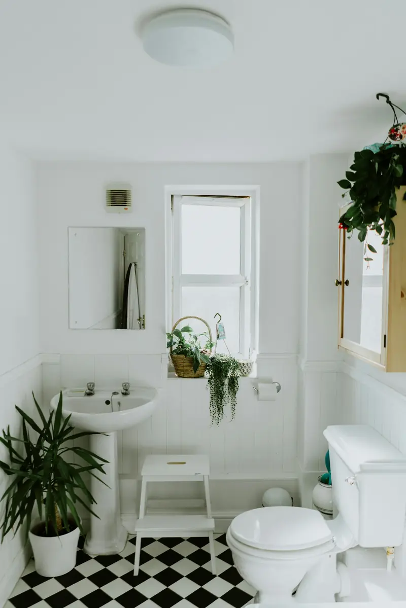 White bathroom with toilet and basin